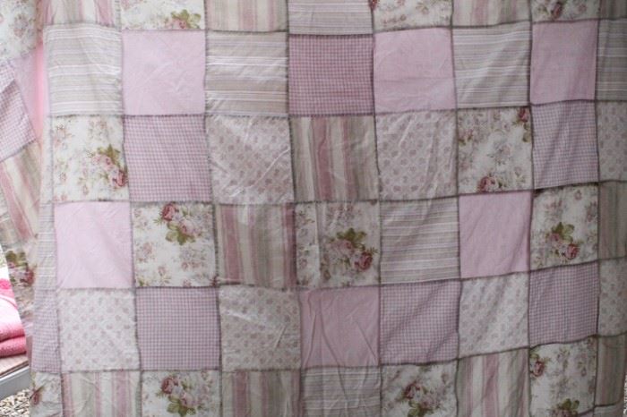 Quilted primarily pink in color