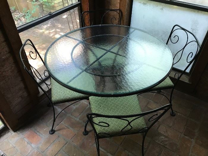 Wrought iron dining table, four chairs