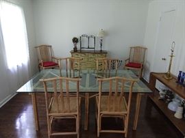 Glass topped rattan table, with six chairs - 2 arm, 4 side.
