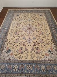 Hand woven Persian Kashan design rug, cornflower blue border, butter yellow center, measures 12' 4" x 9' 2".