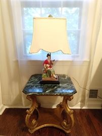 Better view of the Italin Florentine side table, with green marble top. The Asian lamp is one of a pair. She's coyly strumming her guitar, singing the song of her people, in hopes of wooing a huzzbun!