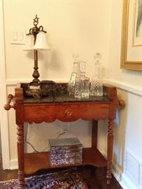 Vintage heart pine dry sink, with black veiny marble top and backsplash - nicely turned spindle legs and double side handles. Nice collection of cut crystal decanters for all those impromptu neighborhood gatherings - you know that lush that lives next door...