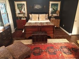 Queen size mahogany sleigh bed, with Sealy Posturepedic mattresses, 4-drawer Chinese red chest, 3-drawer heart pine chest, vintage wooden trunk, 5-drawer Asian style mahogany chest, pair of signed/numbered Marc Chagall lithographs, Persian Viss runner, nicely upholstered armchair, w/matching ottoman. 