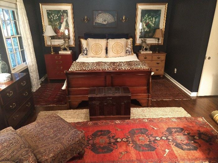 Queen size mahogany sleigh bed, with Sealy Posturepedic mattresses, 4-drawer Chinese red chest, 3-drawer heart pine chest, vintage wooden trunk, 5-drawer Asian style mahogany chest, pair of signed/numbered Marc Chagall lithographs, Persian Viss runner, nicely upholstered armchair, w/matching ottoman.