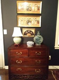 5-drawer Asian-inspired mahogany chest, celadon porcelain table lamp, blue/white Asian porcelain box, newer ewer, pair of vintage, framed Asian figural art & fan.