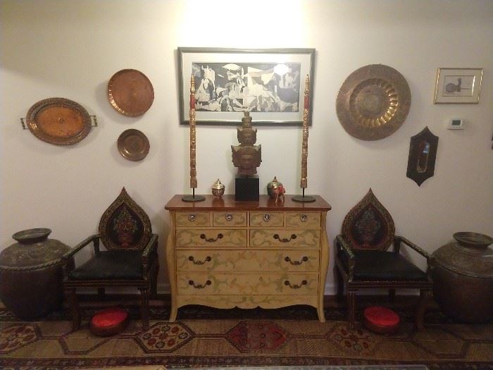 Fun hand painted Moroccan chairs, hand painted 6-drawer chest, cobra pots, footstools, copper pots to bang on and a Picasso print, or IS it a print? She has a LOT o' dough, so ya nevah know...