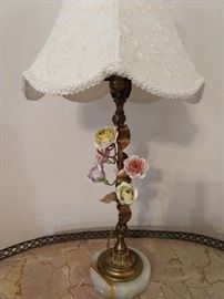 Close-up pic of the vintage Italian table lamps, with hand painted porcelain flowers, matching finials, onyx base and awful shade! :-)