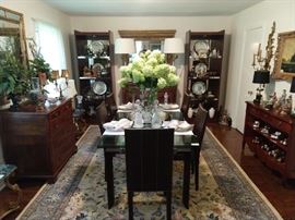 Beautifully engineered Roche Bobois "Stilt" contemporary dining table. This extendable table from is made of glass, wood, and brushed metal. Glass panels extends to 1’ on each side. This condition is almost new; fully extended length is 120".