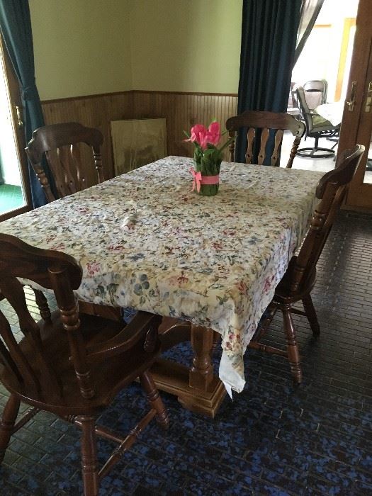 This dining room table matches the earlier china cabinet -- they have an oak finish.