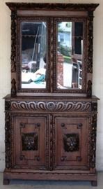 Heavily carved Jacobean bookcase