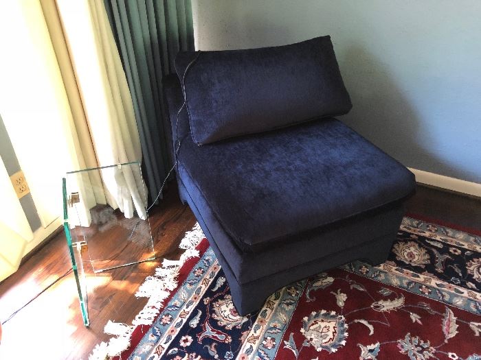 One of two matching immaculate navy blue slipper chairs