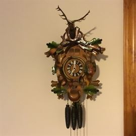 Cuckoo Clock with Deer & Rifle Décor           https://ctbids.com/#!/description/share/32586