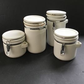 Set of 4 White Ceramic Canisters         https://ctbids.com/#!/description/share/33136
