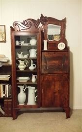 Antique secretary bookcase with hand carving & beveled mirror