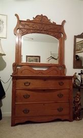 Antique oak dresser with beveled mirror & applied carving