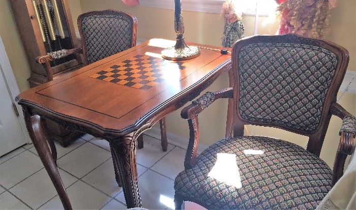 Game Table and Two Upholstered Arms Chairs