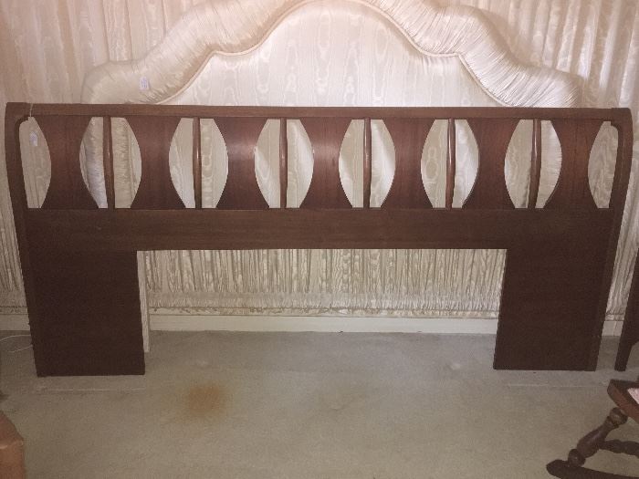 Headboard to match rest of suite (wood) and a fabric-covered one behind - both are in great condition...