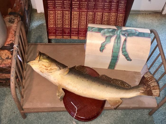 The fish's name is Robert Bentley.  The small metal doll bed is about 1920.