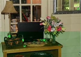 TV and TV stand on sun porch.