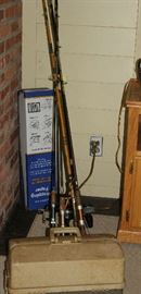 Some fishing reels with tackle box.