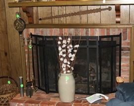 Fire screen and items on fire place.