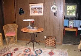 Black metal round table with red and white vinyl top.