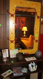 Mirror painted in yellow with polka dots and red hooks. Goes with chalk board and piano.