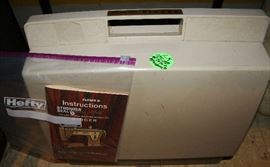 Singer Zig-Zag sewing machine with accessories and book. In case.