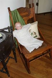 Old rocker with baby doll.
