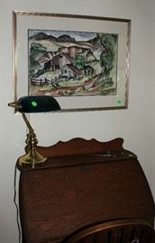 A lovely water color above desk signed.