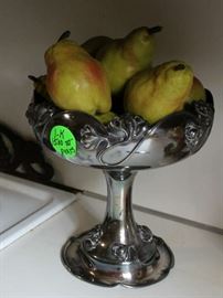 Silver stand with pears.
