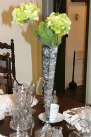 Silver flower vase with flowers.