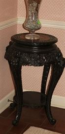 This is the plant stand with marble top.