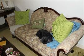 The Victorian couch with lovely carving.