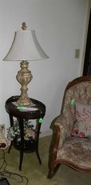 A beautiful mahogany end table with lots of carving.