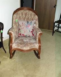 The Victorian rocking chair that matches the sofa.