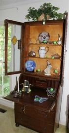 A antique oak secretary with stained glass doors. Also in excellent condition.