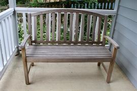 A very sharp looking teak settee, all weather.
