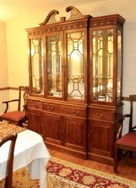 Stickley China hutch, flanked by two Stickley arm chairs.