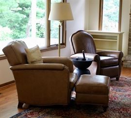 Two leather chairs - one recliner and one lounge chair with ottoman. Buttery soft leather.