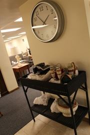 Here's a Pottery Barn wicker double shelf - perhaps for plants?