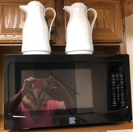 Look at that faceless babe taking the picture  in the microwave reflection!  