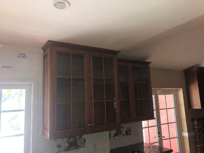all wood cabinet with glass doors