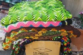 selection of hand knitted shawls/afghans