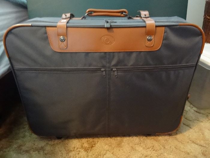 set of 4, large on wheels, also has a garment bag