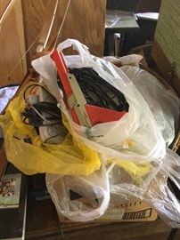 Bags upon bags of vintage  video game consoles with game cartilages 