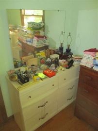 Dresser with mirror and household items