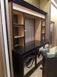 This is a 2 piece bar with granite counters and complete rear hutch/display. It has storage and a pull out shelf with cabinet doors front and back.