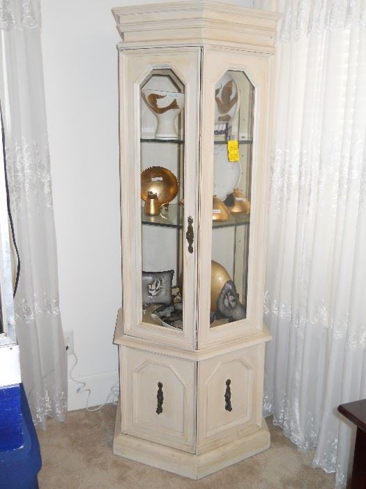 off white lighted curio cabinet with glass shelves