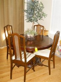Vintage round pedestal table, 4 cane back chairs, etc.